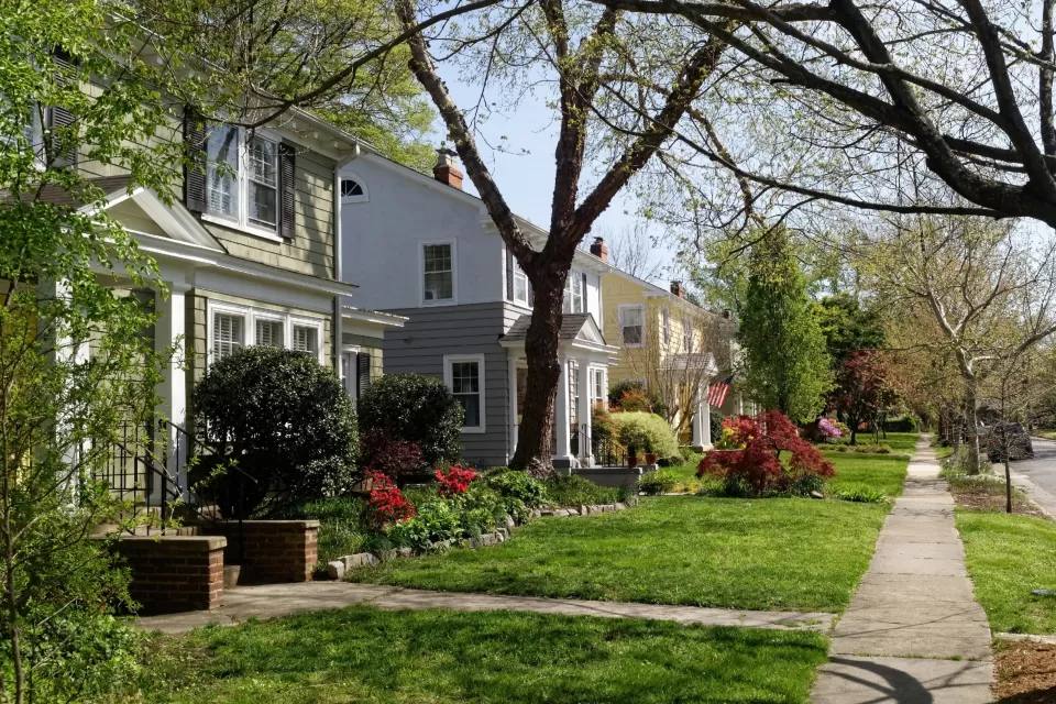 Two-story houses on tree-lined street in Richmond, Virginia